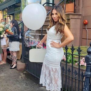 Beautiful white lace dress. Very flattering! Worn once.